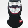 Black balaclava with a large graphic of white teeth across the mouth area and a red accent beneath the design.