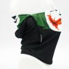 Black fabric face covering with a green and orange graphic at the top, shown on a white mannequin head.