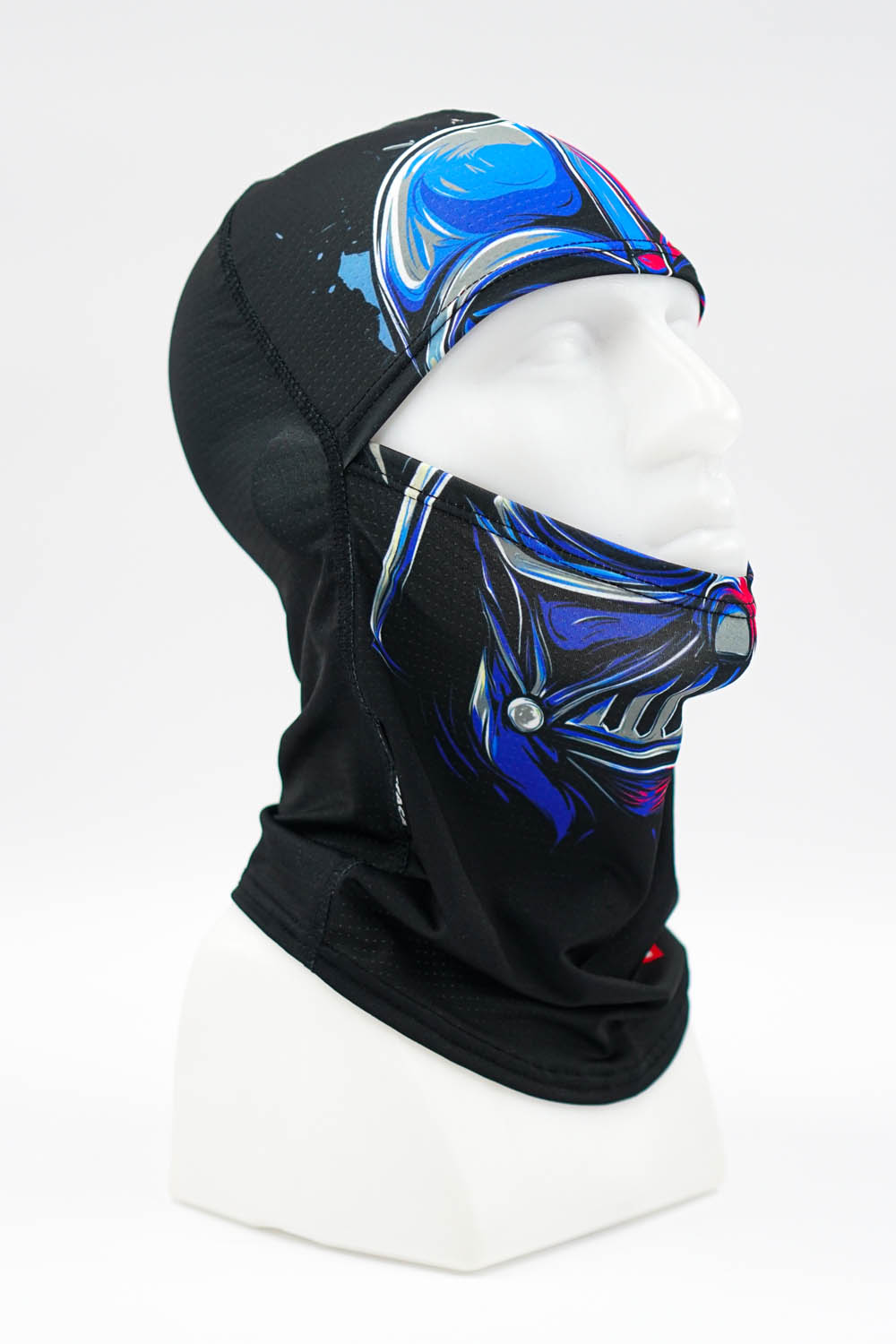 Black balaclava with blue and silver abstract graphics displayed on a white mannequin head